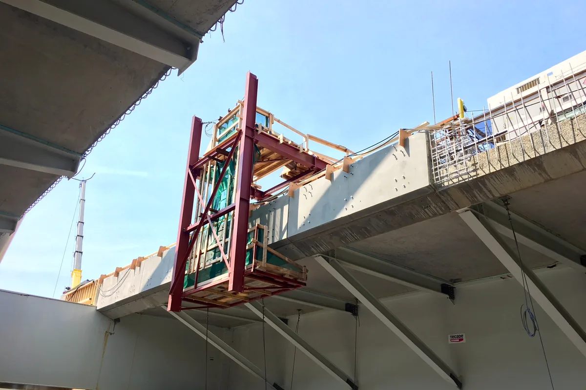 Cantilevered access platform beneath a bridge deck
