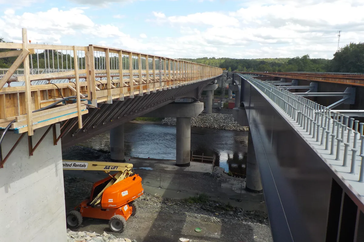 Cantilever formwork brackets on a bridge deck